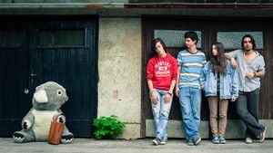 <!--LINK'" 0:458--> posing together with their mascot at <!--LINK'" 0:459--> in 2015