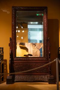 A Chinese wooden mirror in the Skušek Collection, <!--LINK'" 0:147-->.