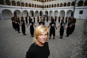 Conductor <!--LINK'" 0:396--> with <!--LINK'" 0:397--> choir in the <!--LINK'" 0:398--> courtyard at Kostanjevica na Krki