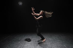 <!--LINK'" 0:1123--> on the small stage of the <!--LINK'" 0:1124--> during her piece <i>Zaklenjeno</i> [Locked], performed at the <!--LINK'" 0:1125-->, 2017