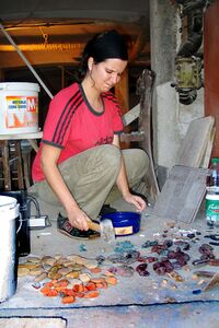 Making a mosaic, during working to refurbish new premises, photograph exhibited in the exhibition <i>Tinčkaua bytes and CMAK</i>, <!--LINK'" 0:810-->