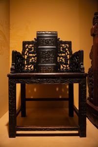 An exquisitely-carved Chinese wooden chair in the Skušek Collection, <!--LINK'" 0:148-->.