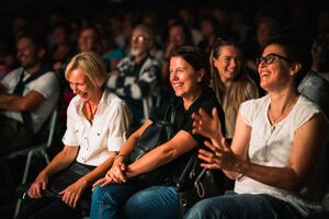 The laughing audience at the international stand-up comedy festival <!--LINK'" 0:324-->, Ljubljana 2022. Author: Jaka Škrlep