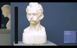 A still frame from <!--LINK'" 0:104--> promo video featuring a marble bust of <!--LINK'" 0:105--> (1876&ndash;1918), the beginner of Modernism in Slovene literature, sculpted by <!--LINK'" 0:106-->, shot in <!--LINK'" 0:107-->, 2013.