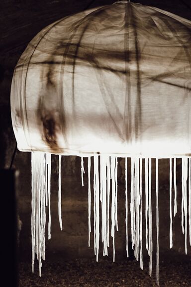 Part of the UnderGROWTH art installation at the Tunnels Under the Old Kranj, created by the artistic group Nika Batista, Matevž Bajde, Mateja Golež, Lovro Ivančić, Marija Jenko, Maruša Kranjc, Franci Krevh, Alenka More, Ula Pogorevčnik, Darja Rant, Janko Rožič and Alenka Vidrgar as part of the 2023 Biennial of Textile Art BIEN.