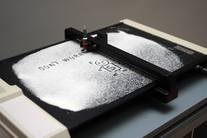 <i>Nanoplotter</i> uses a plotter, an obsolete printing machine from the 1980s, adapted to an uncommon operation. By the artist collective <!--LINK'" 0:266--> at the <i><!--LINK'" 0:267--></i>, <!--LINK'" 0:268-->, Ljubljana, 2010.