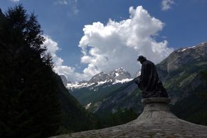 A statue of Julius Kugy with the orientation toward Jalovec Mountain. Julius Kugy (1858-1944) was a mountaineer and researcher of Julian Alps, <!--LINK'" 0:585-->, 2014